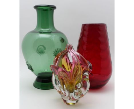 Three items of Art glass, includes; a green vase of baluster form 37cm high, a red vase 29cm high, and a basket form vase 23c