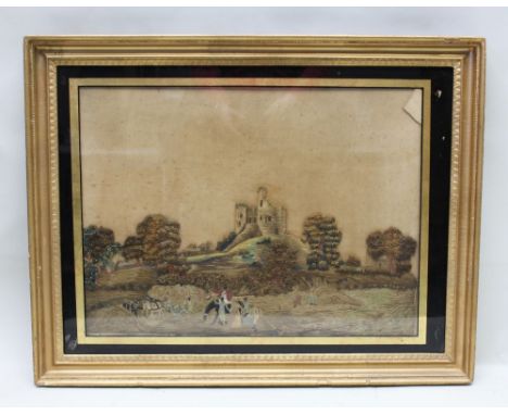 A first-quarter 19th century hand stitched silk work picture of a fortification upon a hill, with a harvesting scene below, t