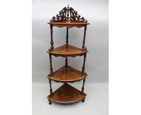 A Victorian walnut four tier corner whatnot of typical form and construction, 128 cm highCondition report: To the top of fini