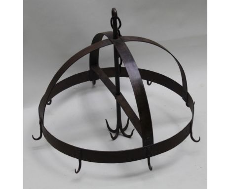 A first quarter 20th century Continental iron hanging rack, eight outer hooks and a central cluster, 53cm excluding chain, 58
