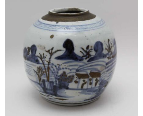 A Japanese glazed ceramic ginger jar, cobalt blue painted landscape decoration, with over glaze gilded highlights, underglaze