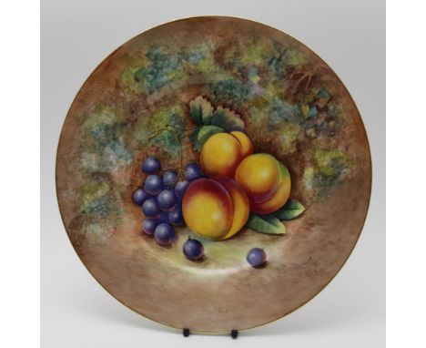 A Royal Worcester bone china plate, painted with fruit on a mossy bank by J.Cook, signed, 27cm in diameterCondition report: N