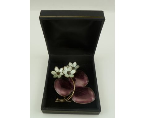 A "HANS MYHRE" DESIGN NORWEGIAN SILVER AND ENAMEL LILY PAD BROOCH, white flowers with purple leaves, stamped "925 sterling - 