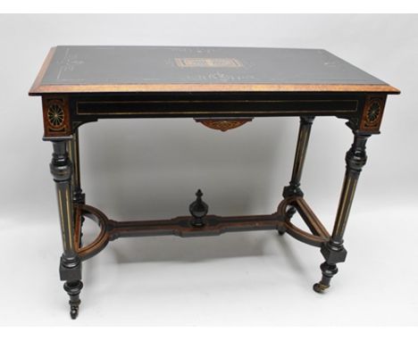 A 19TH CENTURY AESTHETIC PERIOD CENTRE TABLE in amboyna and ebony finish, having anthemion design rectangular top, on four tu