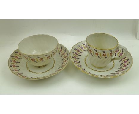 A FLIGHT WORCESTER PORCELAIN TEA BOWL AND SAUCER and matching COFFEE CUP AND SAUCER, pink and gilt painted border on wrythen 
