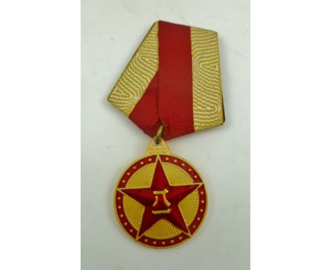 A 20TH CENTURY CHINESE AUGUST 1ST MEDAL, red enamel on a ribbon with pin fastening, 3cm diameter 