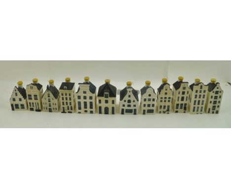 A COLLECTION OF TWELVE VARIOUS CERAMIC MODELS OF DELFT HOUSES made by KLM to contain Bols alcoholic drink 