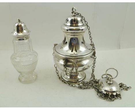 GEORGE UNITE A CUT GLASS SUGAR SIFTER of baluster form with silver cap, Birmingham 1927, together with a PLATED CATHOLIC INCE