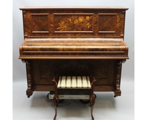 A LATE 19TH/EARLY 20TH CENTURY WELL-FIGURED WALNUT UPRIGHT PIANO, bearing the name "Russell", having fancy inlaid panelled ba