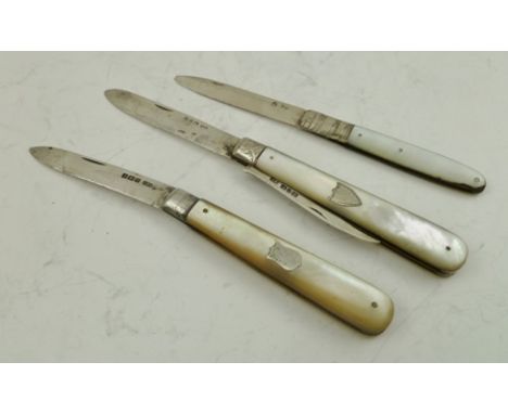 A VICTORIAN MOTHER-OF-PEARL AND SILVER FRUIT KNIFE with orange peeler, Birmingham 1889, ANOTHER FRUIT KNIFE 1917, and a Georg