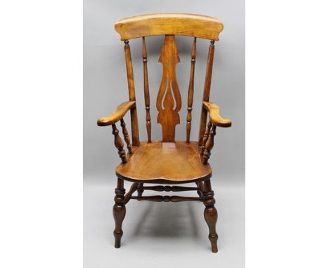 A 19TH CENTURY PROVINCIAL ASH AND ELM OPEN ARMCHAIR having pierced splat back, scrolling terminal arms, saddle seat, supporte