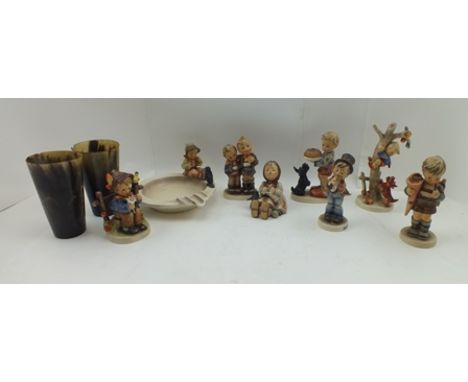 A COLLECTION OF EIGHT GOEBEL CERAMIC CHILD FIGURINES, includes a boy and a bird perched on the edge of an ashtray, together w