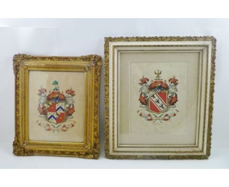 TWO FRAMED HERALDIC PANELS, a Watercolour on paper, full shield with helm, crest, mantel and motto, one inscribed "Ostick", t