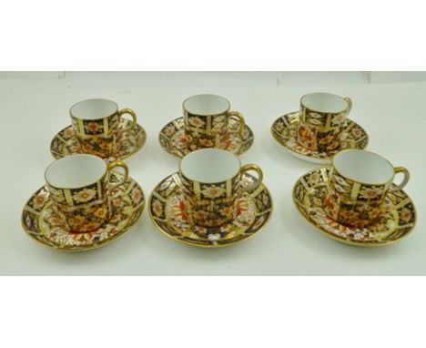 A SET OF SIX ROYAL CROWN DERBY COFFEE CANS WITH SAUCERS decorated in the Imari pattern, no.2451 