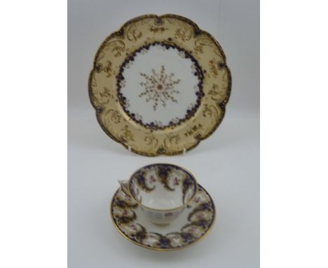 A WORCESTER PORCELAIN CABINET CUP AND SAUCER, gilded cobalt blue border with pink roses, puce factory backstamp, together wit