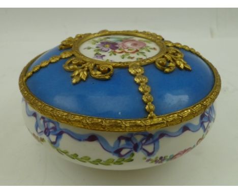 A SEVRES CERAMIC BOWL, with cover, having hand painted floral swag and ribbon decoration, the cover of blue ground with centr