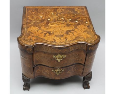 AN 18TH CENTURY DUTCH INLAID WALNUT COMMODE LATER CONVERTED TO A LOW TWO-DRAWER CHEST, having allover fauna and flora design,