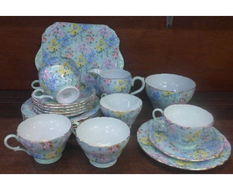 A Shelley six setting Melody tea service comprising a cake plate, six trios, sugar and cream, one cup a/f