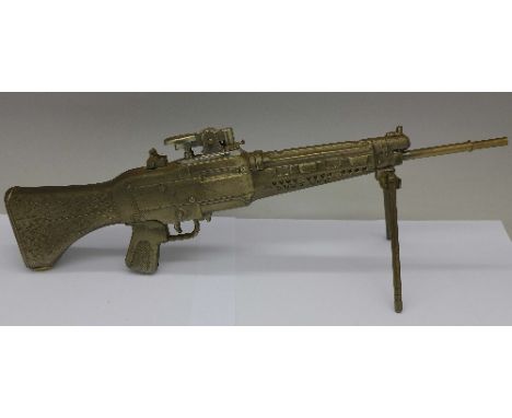A novelty lighter in the form of a rifle