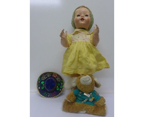 A Pedigree celluloid doll and a Steiff rabbit with badges and charity passport