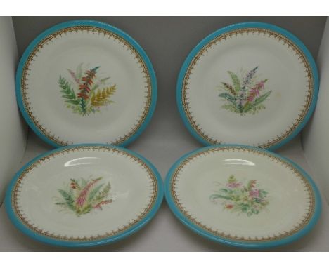 A set of four Royal Worcester plates decorated with flowers