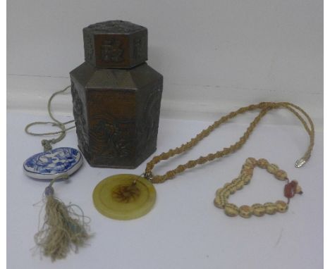 An oriental caddy, pendants, bracelet, etc.