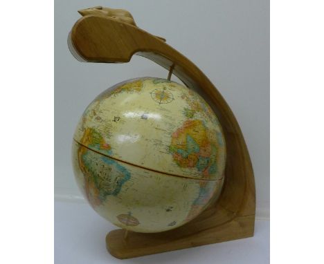 A Replogle 12" diameter World Classic globe on an American bog oak stand