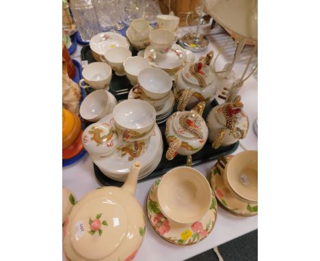 A Japanese egg shell porcelain tea service, moulded with dragons and decorated with lithophanes of Geisha girls, a part tea s