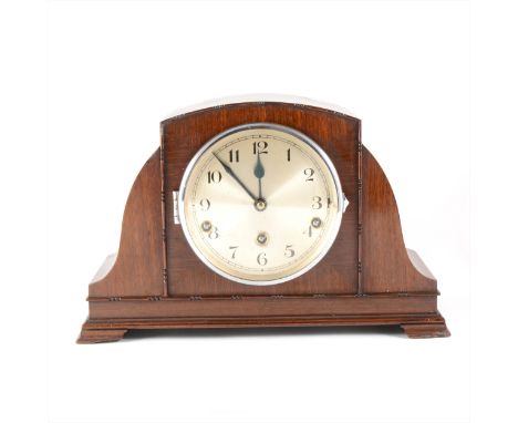 A 1930s mahogany mantel clock, striking on five gongs, 24cm.