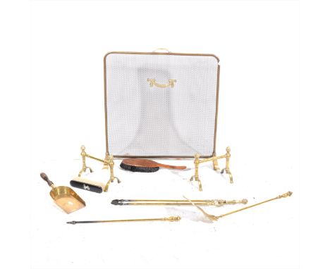 A matched set of brass fire irons, a pair of brass andirons, a mesh fire screen, old shovel, etc.