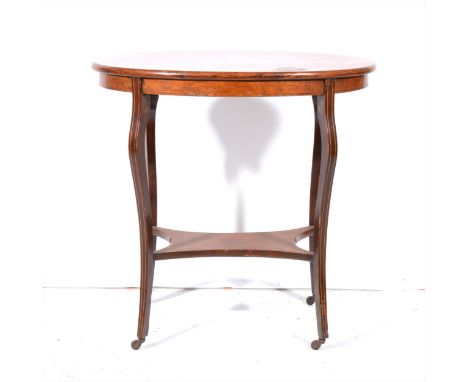 A Victorian rosewood and marquetry occasional table, oval top with an oval panel, musical instruments, shaped legs joined by 