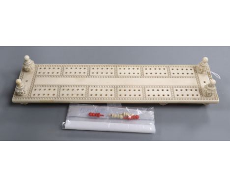 An ivory cribbage board