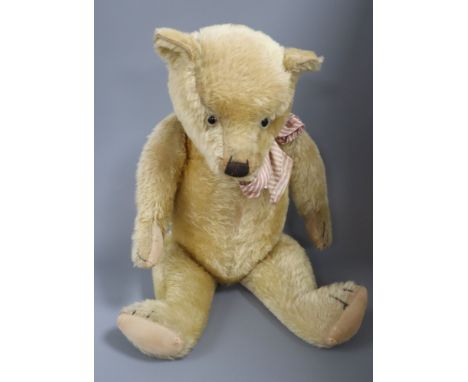 An English Chiltern type bear, 27in., good condition, original pads, glass eyes