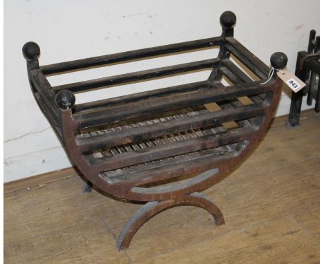 A cast iron fire grate and dogs Fire grate W.56cm