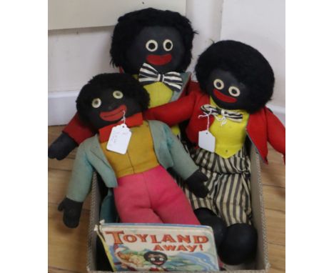 Three Gollies, one Deans with label, 20in., two Chad Valley, 22in., the other 23in. and a book