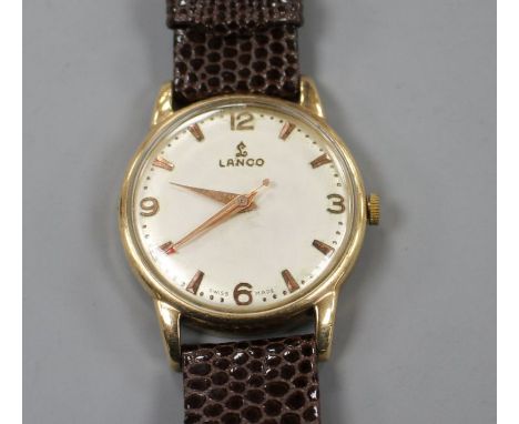 A gentleman's late 1950's 9ct gold Lanco manual wind wrist watch, with baton and Arabic numerals, on associated strap.