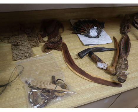 An Asmat Regency, Papua carved wood figural ceremonial sago bowl and various other tribal artifacts, including a woven fibre 