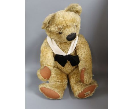 A large Chad Valley bear, foot label, very good condition, small tear to left paw pad, glass eyes, thick mohair