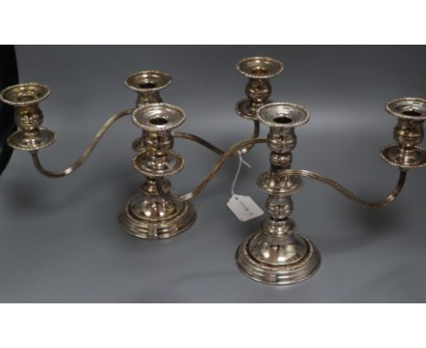 A pair of plated three light candelabra