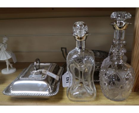 A silver-mounted dimple decanter, a similar cut glass decanter, a plated entree dish and two other plated items