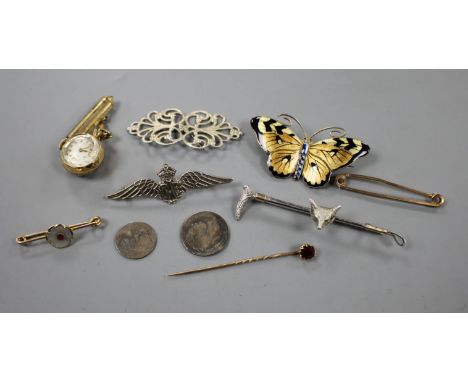 An early 20th century 930s and enamel butterfly brooch, garnet stick pin, two yellow metal bar brooches, fox head bar brooch,