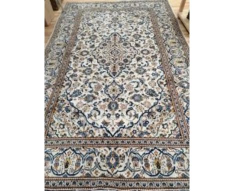 A Tabriz ivory ground carpet 300 x 200cm