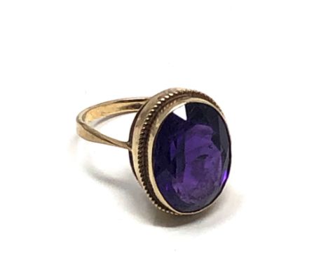 9ct Gold Amethyst Cocktail Ring (4.9g)&nbsp;Scratch to the inside of the centre stone and a scuff on the outside bottom right