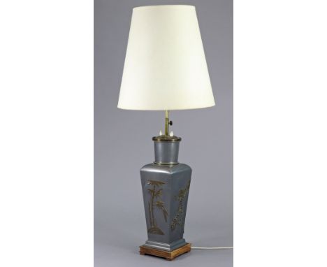 A Chinese silvered-metal table lamp of square form with applied floral decoration, 40’” high over-all.