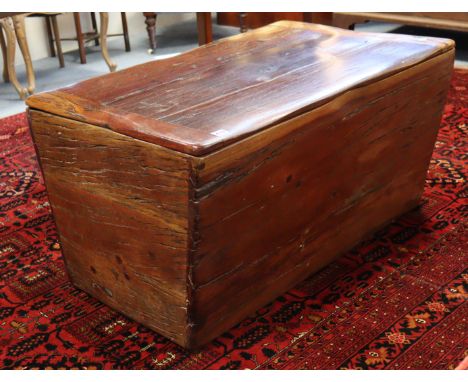 A 20th century hardwood trunk of tapered rectangular form, with hinged lift lid, 37¼” wide x 20” high x 24½” deep. 