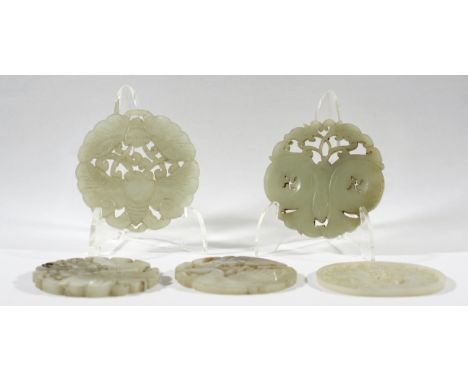 COLLECTION OF SEVEN CHINESE CELADON JADE BI DISCS, with carved and reticulated decoration in the form of a bat, butterflies, 