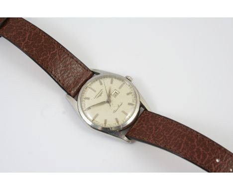 A STAINLESS STEEL SILVER ARROW AUTOMATIC WRISTWATCH BY LONGINES the signed circular dial with baton numerals and date apertur