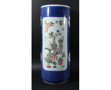 CHINESE FAMILLE ROSE SLEEVE VASE OR STICK STAND, Kangxi style, enamelled with panels of floral gardens and vases on a powder 