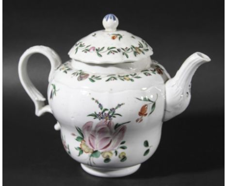 BRISTOL PORCELAIN TEAPOT AND COVER, circa 1770-80, of ogee form, painted with floral sprays beneath meandering foliate border