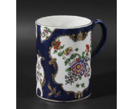 WORCESTER TANKARD, circa 1770, painted with cartouches of flowers on a blue scale ground, blue fret mark, height 12.5cm